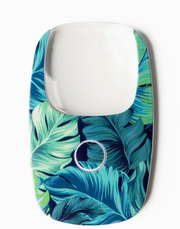 credit card size magnifying glass with LED light, small push button to activate light.
Navy background with shades of blue and green palm fronds