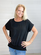 women's fashion top, wide neckline, smocked waist, drop shoulder, and center-split hem on the back