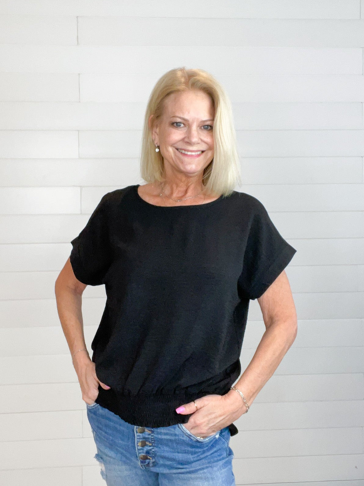 women's fashion top, wide neckline, smocked waist, drop shoulder, and center-split hem on the back